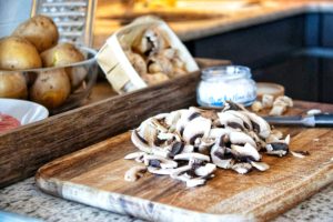 Cut Champignons on a wooden board